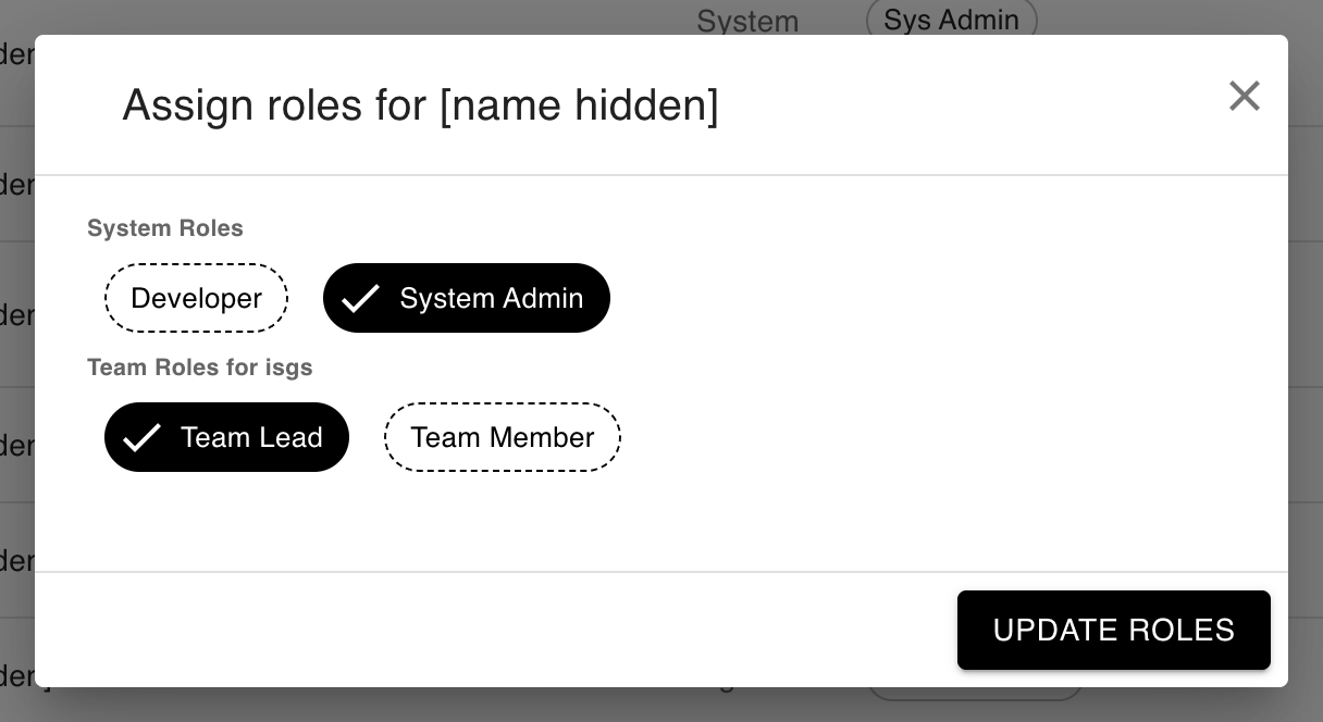 Assign roles dialog showing selectable system and team role chips